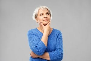 Elderly person deciding between a stair chair or an elevator